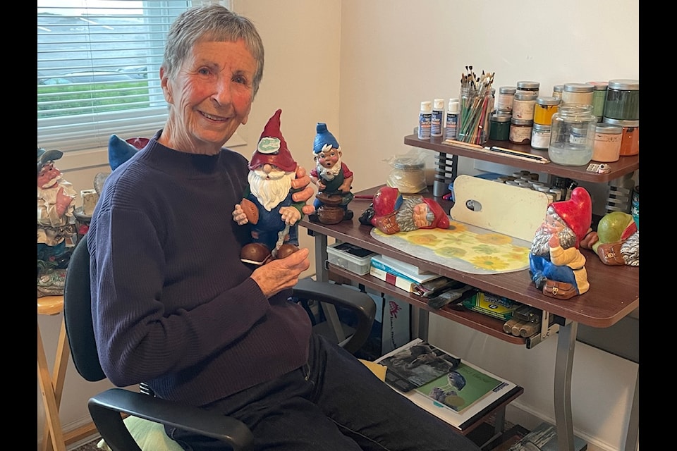 Lynn Jones at home in her studio where she spends her mornings repainting gnomes.