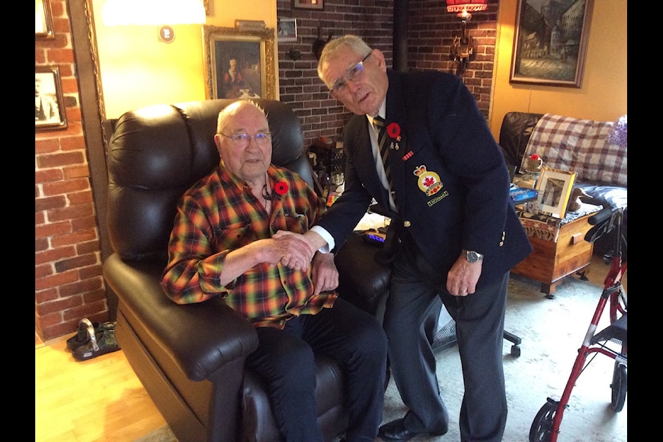Chemainus Legion President David Nielsen pins the first poppy of the year on veteran Frans Vandenbrink at the start of the 2024 poppy campaign.