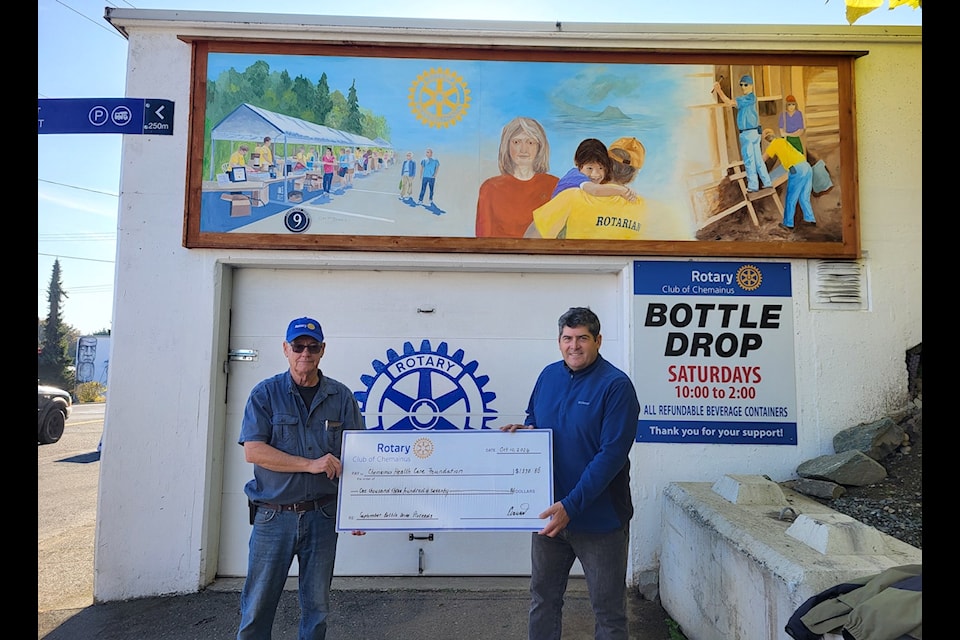 Chemainus Rotary president Derek Hardacker presents a cheque to Paul Edwards of the Chemainus Health Care Foundation. 