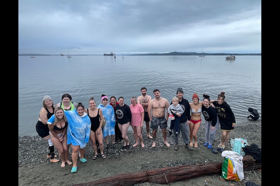 The clouds may have been  foreboding but 2025 is looking great for this bold group of polar bear swimmers in Chemainus.