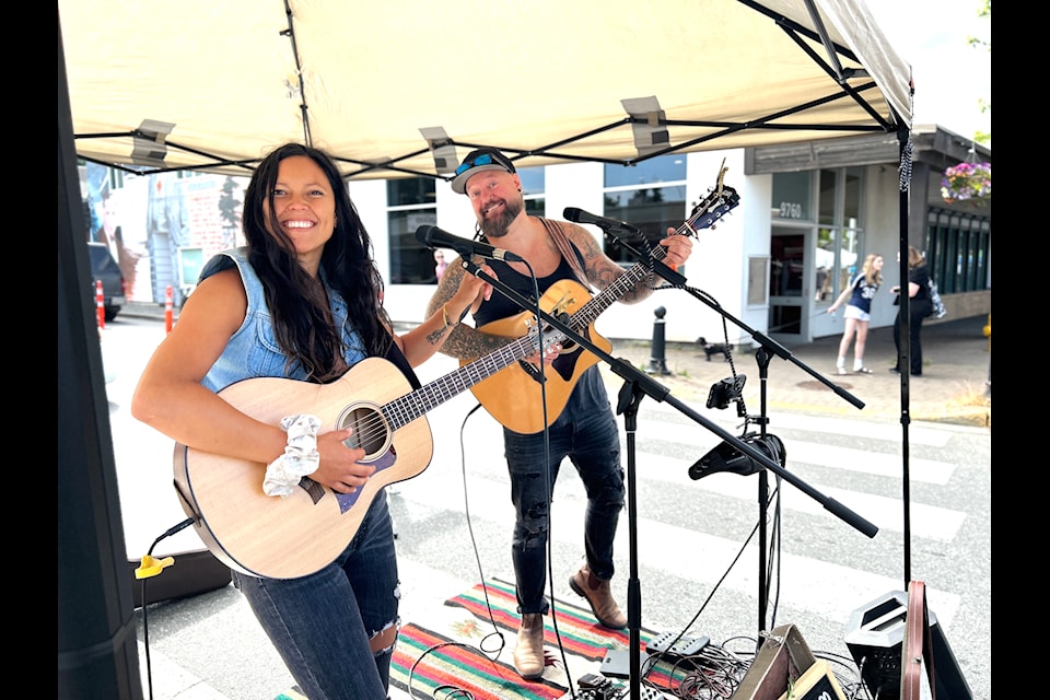 Live music by From the Earth drew a crowd and brought a festive energy to the downtown core during the inaugural Summer Sip & Shop.