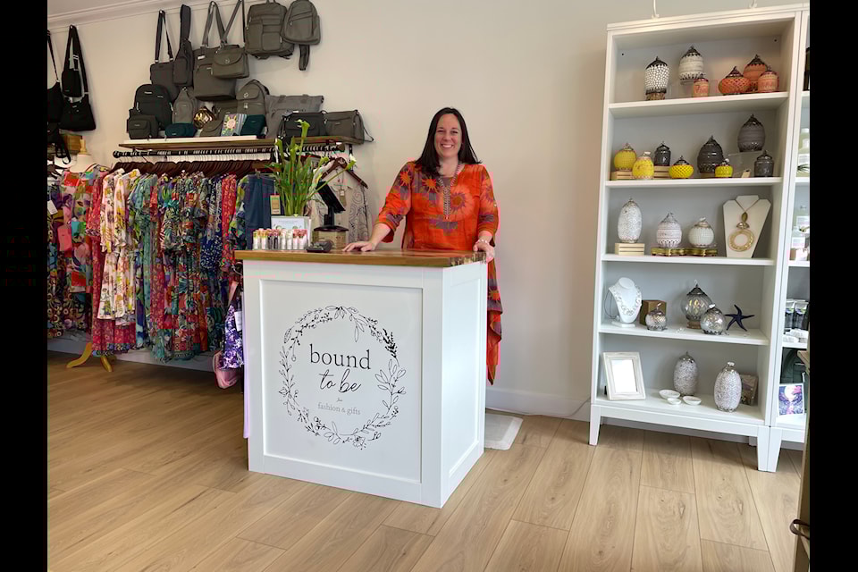Amy Hughes, owner of Bound to Be, welcomes guests to her new location, just two doors down from her previous spot.