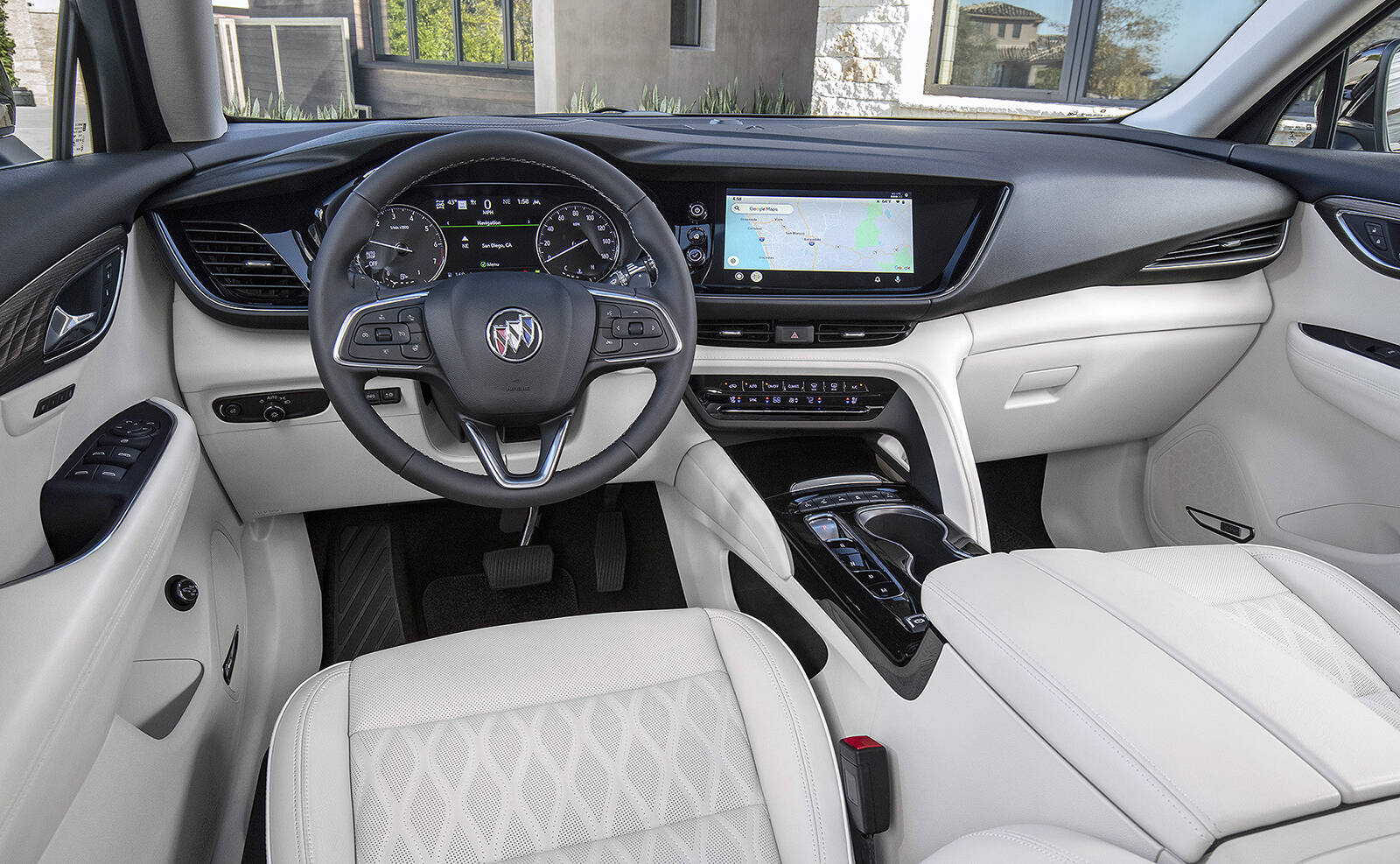 The redesigned interior replaces the shifter handle with a row of buttons, and the touch-screens are more neatly integrated into the dash. This is the inside of the new Avenir trim, but its similar to that of the lower trims. PHOTO: GENERAL MOTORS