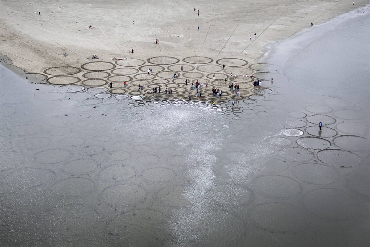 Tides overtake sprawling sand sculpture mural on B.C. beach, just as