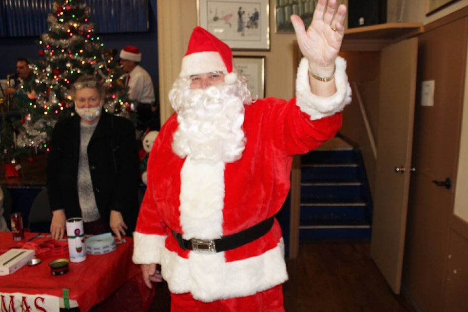 Hello Santa! Greetings are extended at Little Town Christmas upon the arrival of the big guy. (File photo by Don Bodger)