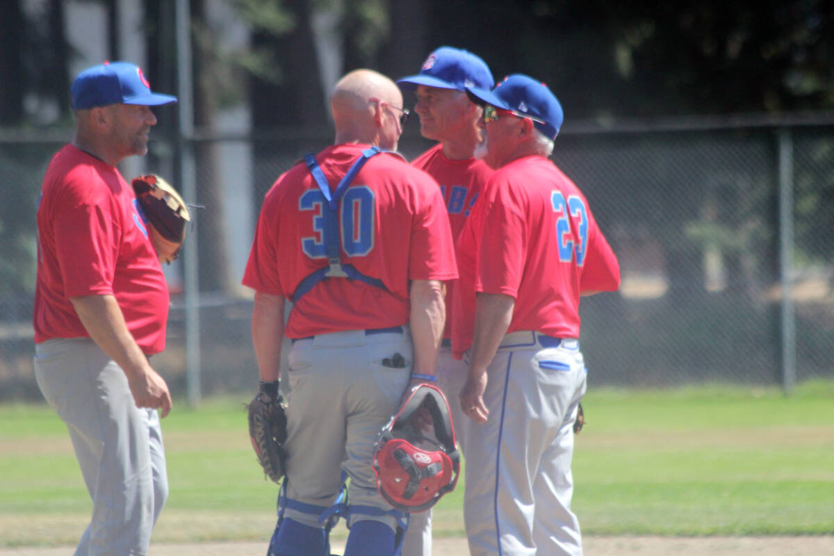 Port Alberni Cubs get together on the mound to discuss strategy. (Photo by Don Bodger)