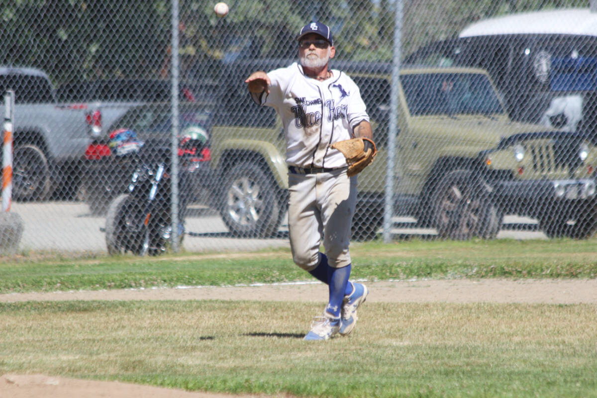 Don Scott makes a great play on the ball for the Blue Heron at third base. (Photo by Don Bodger)