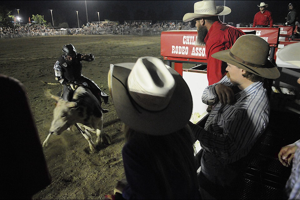 A bullrider competes in the 36th Chilliwack Rodeo at the 152nd Chilliwack Fair at Chilliwack Heritage Park on Friday, Aug. 9, 2024.