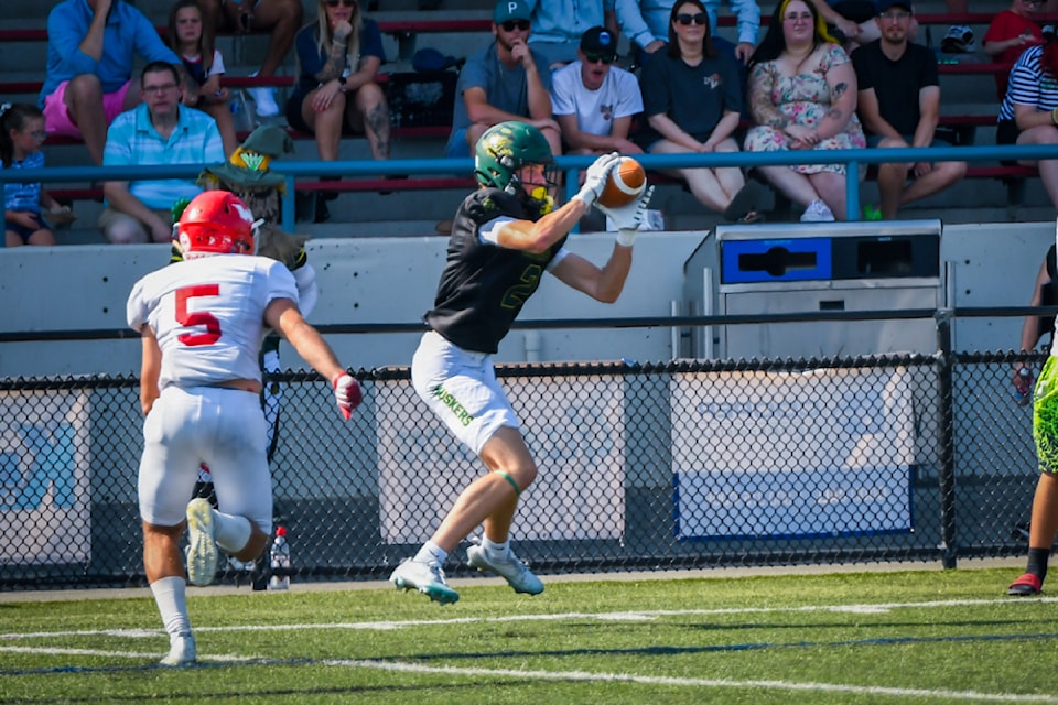 Wide receiver Colby Johnson hauls in a pass during the Valley Huskers matchup against the Westshore Rebels on Saturday, Aug. 17 at Exhibition Stadium in Chilliwack.