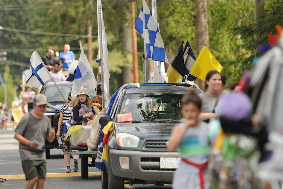A parade makes its way along Sunnyside Boulevard during Cultus Lake Day on Saturday, June 22, 2024. 