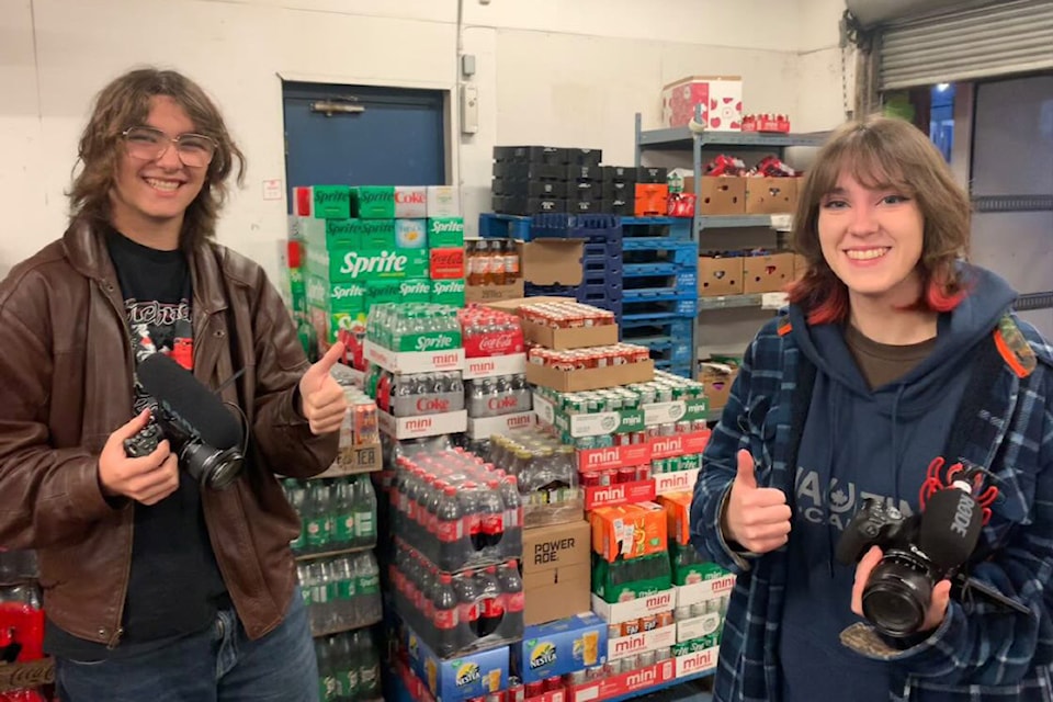 G.W. Graham Secondary School students Wesley Eagles and Ashley Dykstra are seen while filming documentary 'Hope Through Struggle - The Story of the Pantry' at the Chilliwack Salvation Army. (Submitted by Ayush Senanayake)
