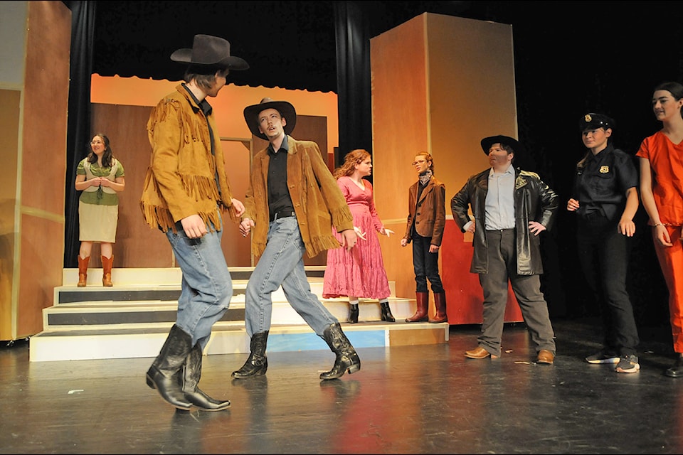 Sawyer Gordon (left) plays Antipholus of Syracusa and Jonah Dyck is Antipholus of Ephesus – they are twins who meet for the first time – in Sardis Secondary's production of A Comedy of Errors. (Jenna Hauck/ Chilliwack Progress)