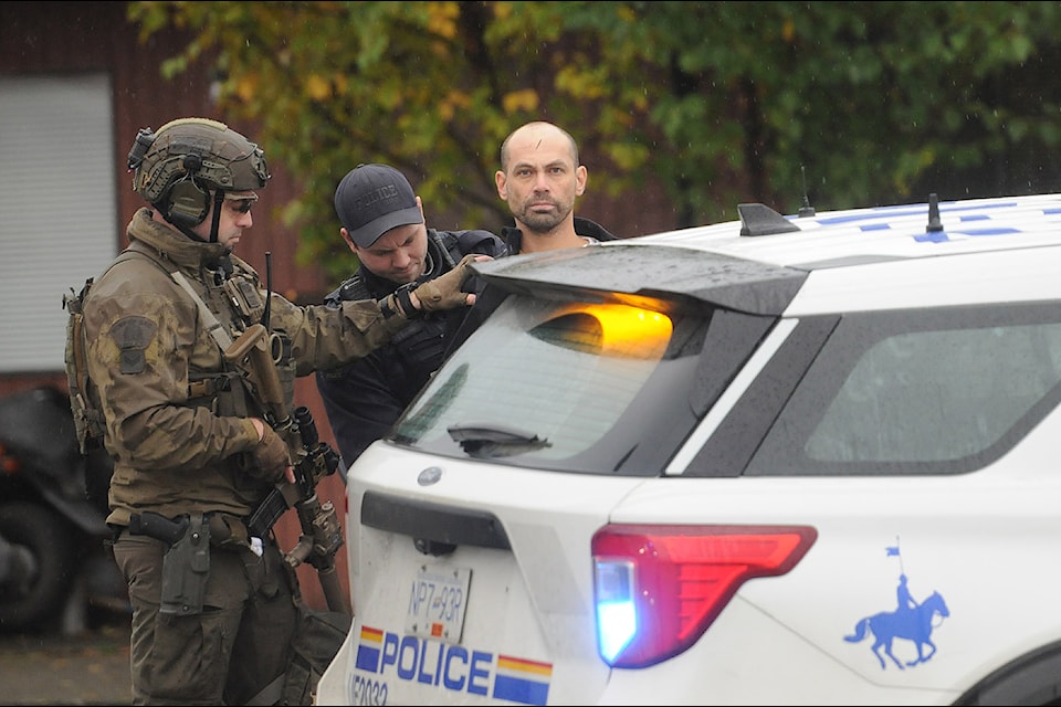 RCMP take a man into custody from a residence on Vedder Road south of Thomas Road on Friday, Nov. 1, 2024. (Jenna Hauck/ Chilliwack Progress)
