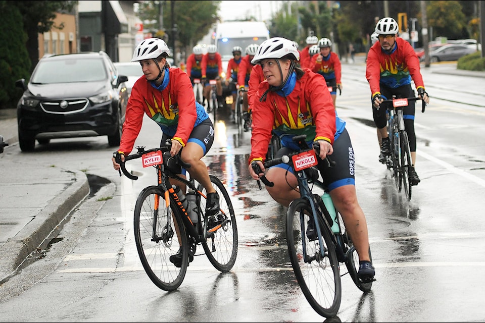 Const. Nikole Craft (front, right) with the Chilliwack RCMP leads the Cops for Cancer Tour de Valley team down Young Road in Chilliwack on Sept. 14, 2024.