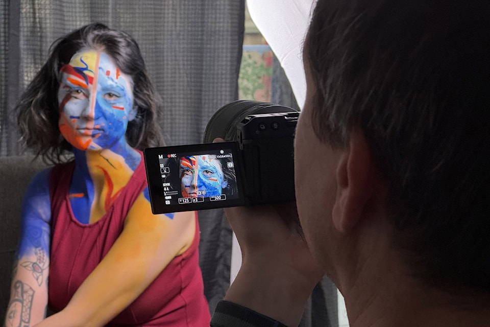 Greg Laychak, a former Black Press Media journalist, reconnects with several subjects in 'Revisited,' a six-episode video podcast that premieres Sept. 24, 2024. Here Laychak films Adria Roberts with an elaborate face painting.