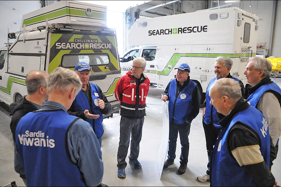 Kiwanis Club of Sardis members (in blue) chat with Chilliwack Search and Rescue members on Wednesday, Feb. 26, 2025. That day, Kiwanis donated $25,000 to CSAR to help pay for its new building.