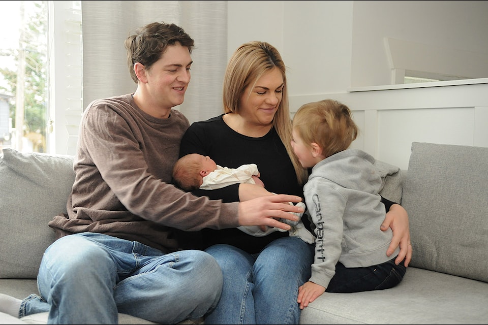 Kyle and Janessa Mueller hold newborn son Odin, with two-year-old Malek. Odin was the first baby born at Chilliwack General Hospital in 2025, arriving on Wednesday, Jan. 1 at 3:37 p.m. weighing nine pounds, 10 ounces. 
