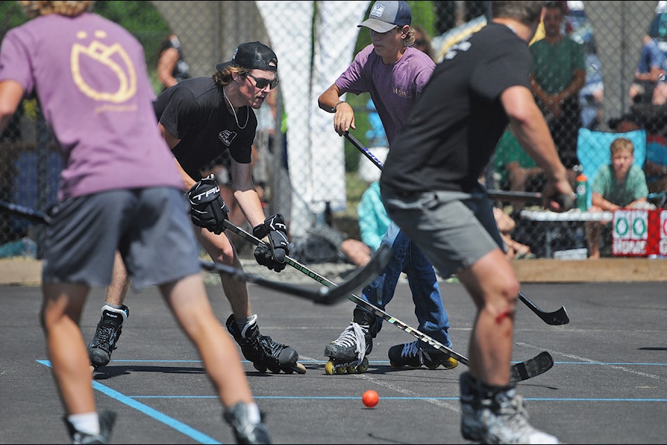 'The Boys' team (in black) goes up against the cousins of Markus Schouten (in purple) during the fourth annual Markus Schouten Memorial Roller Hockey Fundraiser in Chilliwack on Saturday, July 26, 2025.