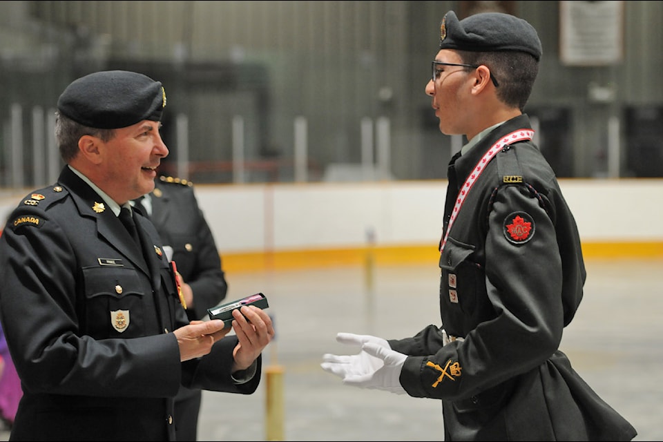 Major Ken Prince awards master warrant officer Trevor Johnson with a King Charles III Coronation Medal during the Chilliwack Army Cadets' 84th annual Ceremonial Review at the Sardis Sports Complex on Saturday, June 14, 2025.