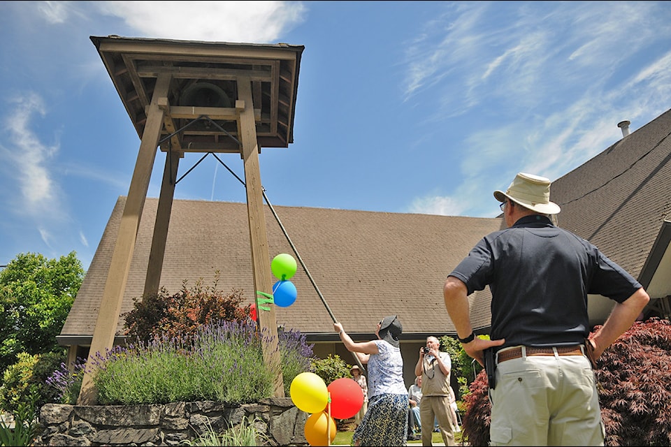 Folks line up to ring a bell during a ceremony at Carman United Church marking the 100th anniversary of the United Church of Canada on Tuesday, June 10, 2025. 