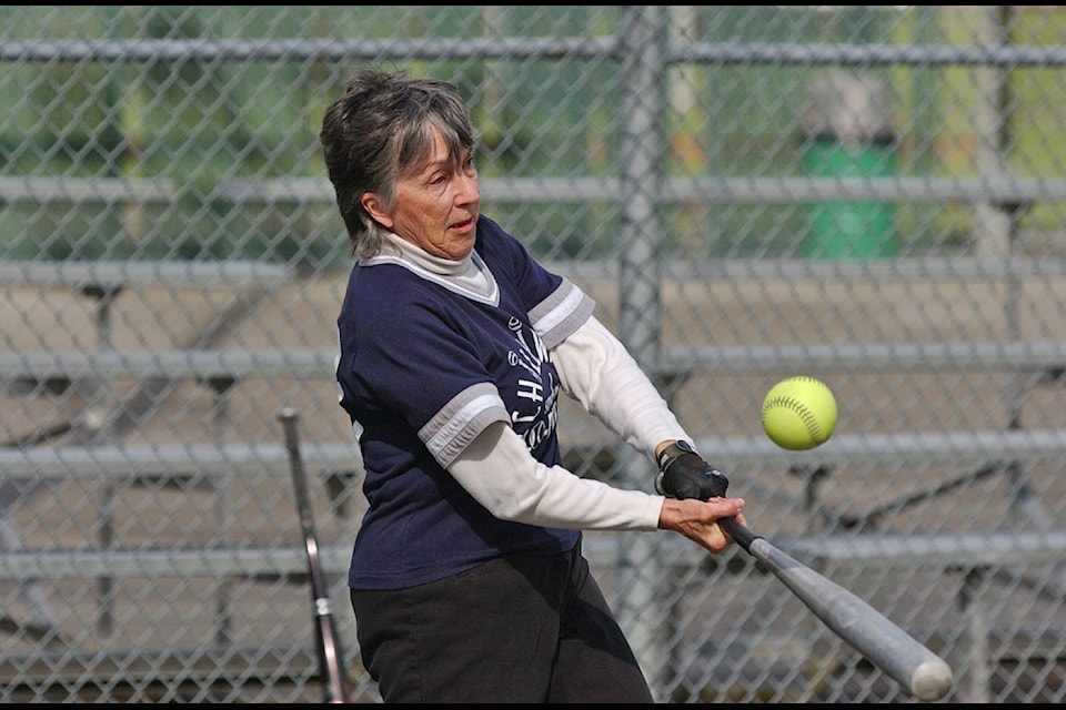Eva Wilgenhof, 76, puts bat to ball during a Chilliwack Senior's Slo-Pitch League game on April 14, 2005 at Townsend Park.