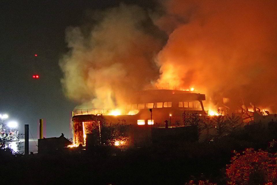 Mission Fire responded to a fire on the derelict Queen of Sidney ferry moored on the Fraser River near Cooper Avenue around 2 a.m. Saturday, May 3, 2025. (Shane MacKichan)