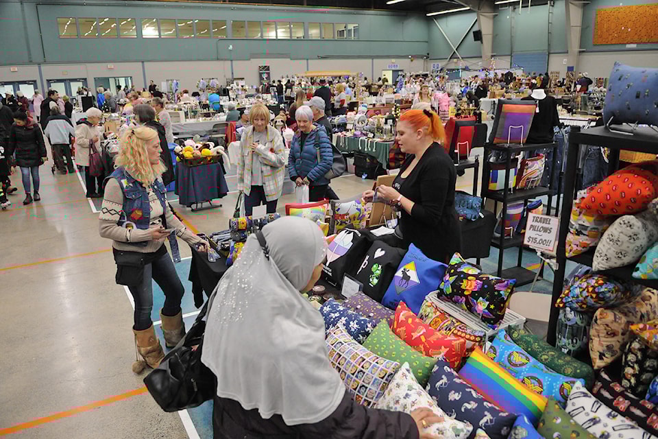 People browse The Christmas Market at the Landing Sports Centre in Chilliwack on Nov. 5, 2022. 