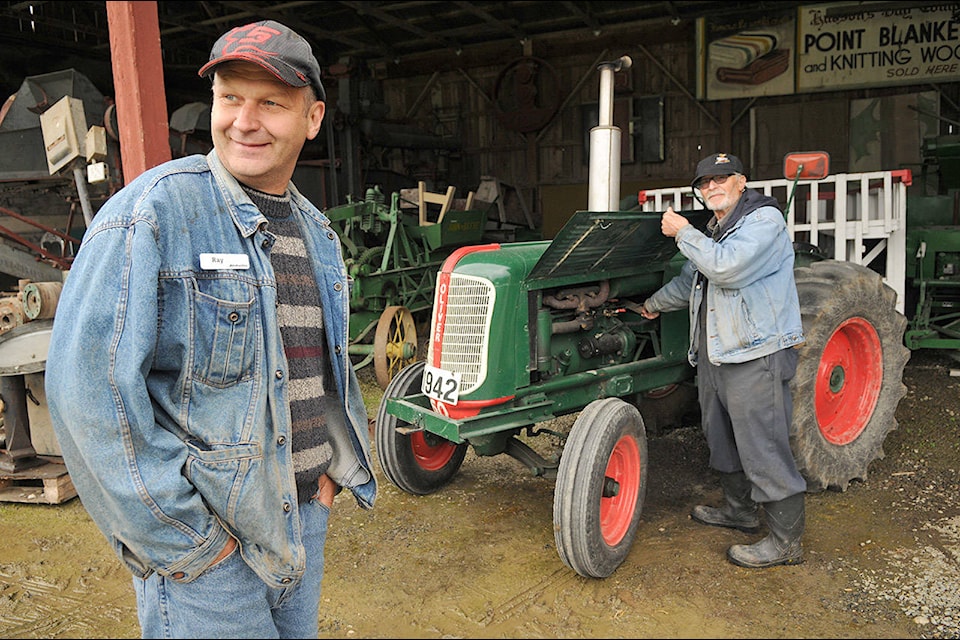 Ray Ramey (left), president of the Atchelitz Threshermen’s Association is pictured with Ron Finnigan in 2017. (Jenna Hauck/ Chilliwack Progress file)