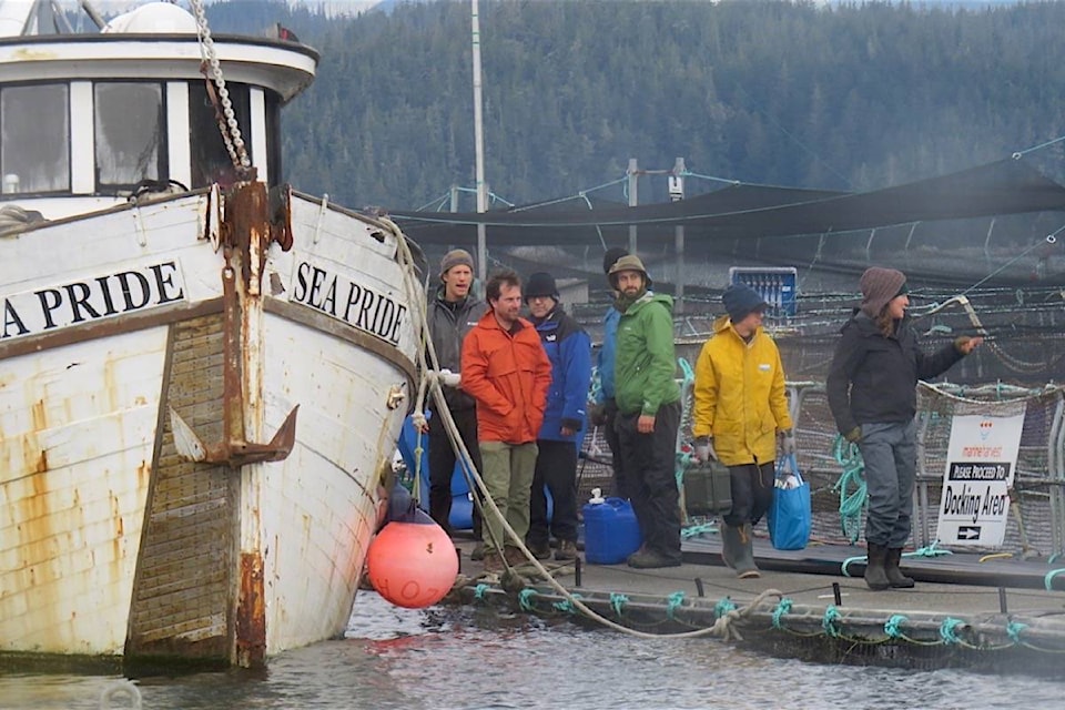9967961_web1_20171227-BPD-salmon-farm-protest-boat-MH