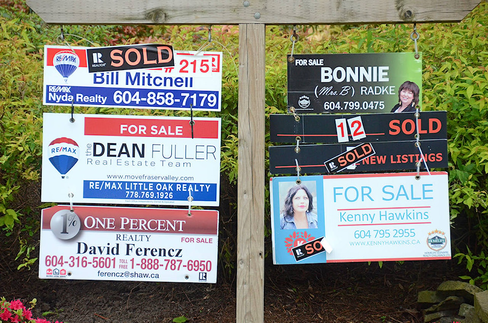 11732907_web1_RealEstate-Sold-Sign