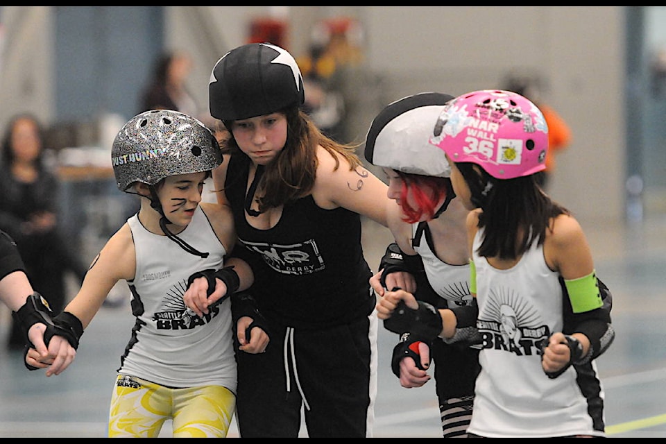 Team TNT (black) with Chilliwack’s NWO Junior Roller Derby league played against the InterStellas of the Seattle Derby Brats at the Landing Sports Centre on Saturday, Jan. 25, 2020. (Jenna Hauck/ The Progress)