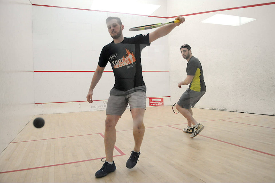 Colten Russell (yellow shirt) plays against Jack Webber during the semi-finals of the 2020 Chilliwack Squash Championship tournament at Cheam Leisure Centre on Saturday, March 7, 2020. (Jenna Hauck/ The Progress)