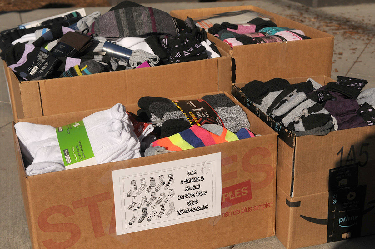 20987178_web1_200318-CPL-Rundle-donates-socks-to-homeless_1