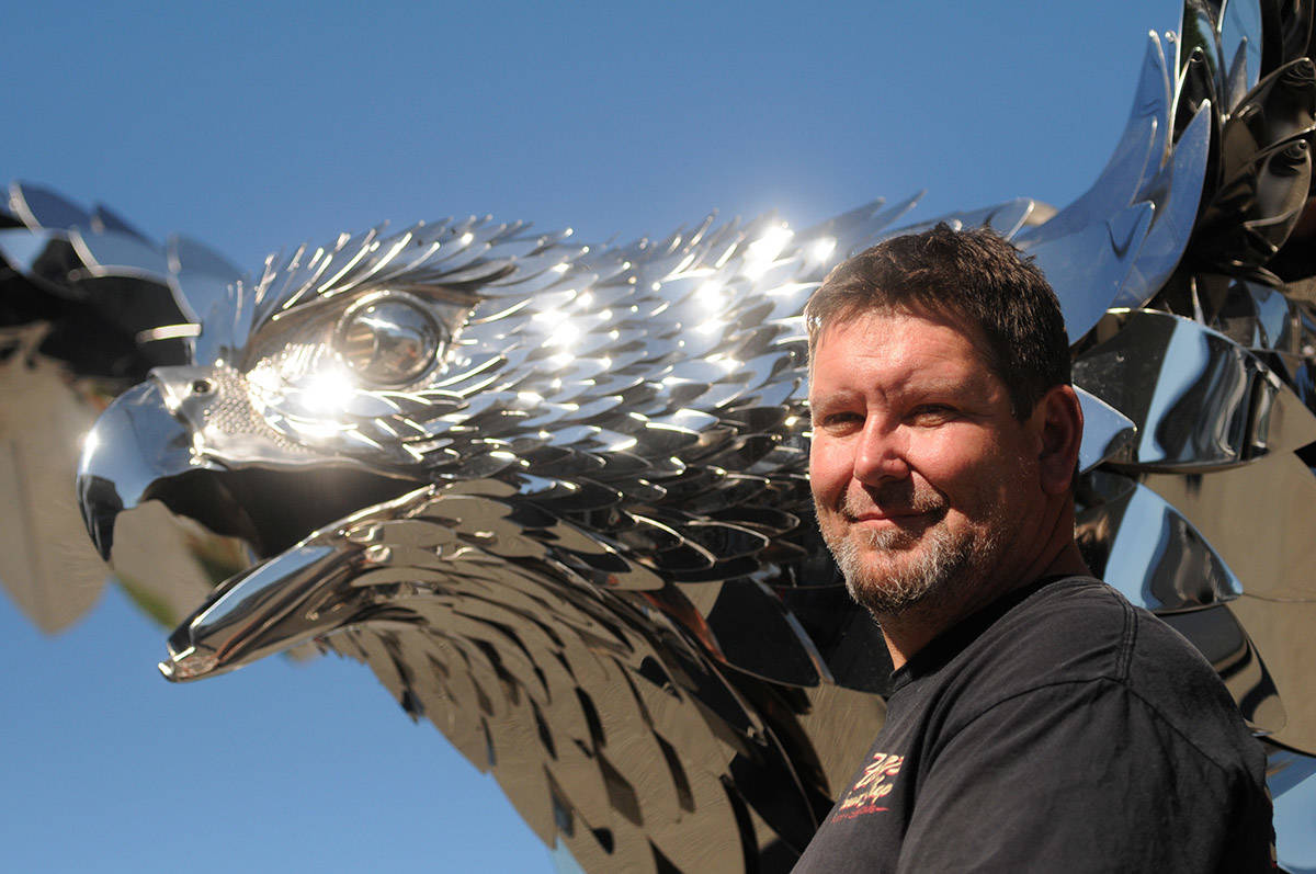 Artist Kevin Stone made this 3,000-pound stainless steel falcon, seen here on display outside his business on Rowat Avenue in Chilliwack on Sept. 29, 2020. (Jenna Hauck/ Chilliwack Progress)