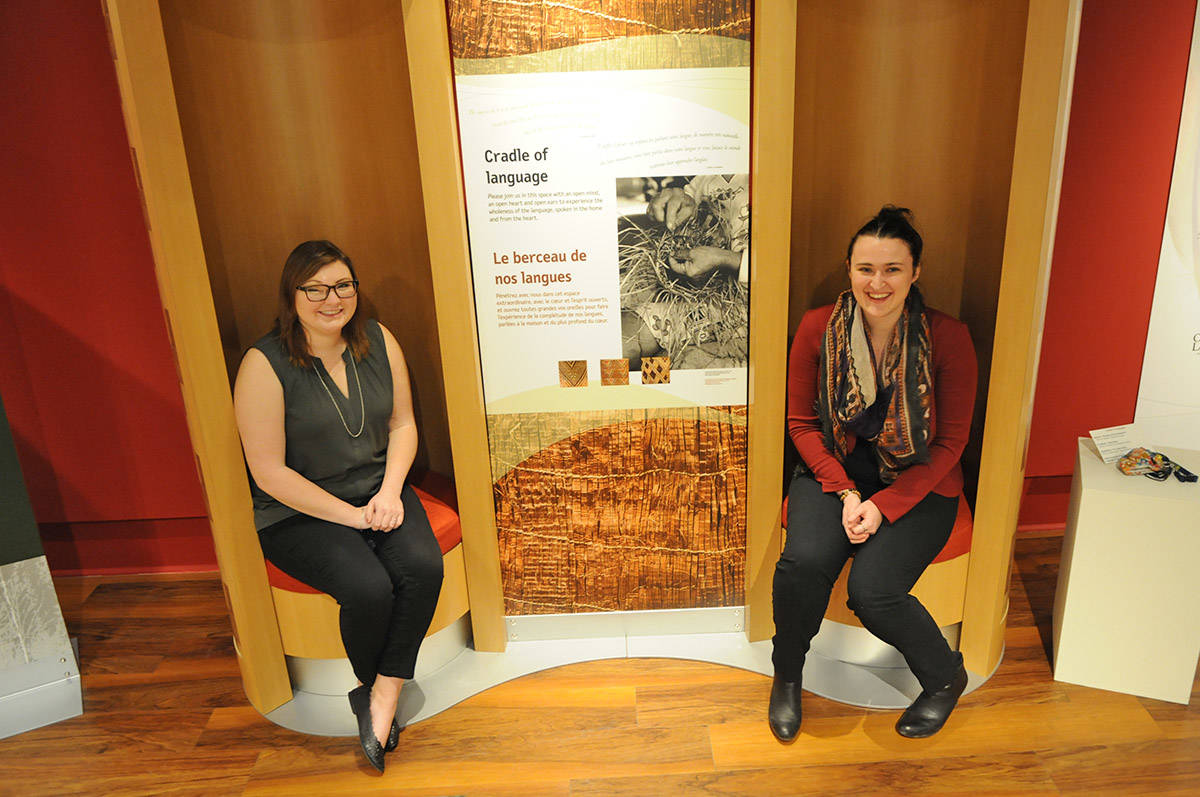 Sydney Laiss (left), curatorial assistant, and curator Anna Irwin stand in the Our Living Languages exhibition on Friday, Feb. 5, 2021. It is currently on display at the Chilliwack Museum and on loan from the Royal BC Museum. (Jenna Hauck/ Chilliwack Progress)