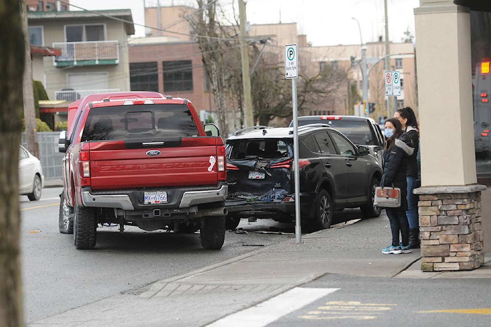 A black sedan, white SUV, red pickup truck and black hatchback were all involved in a four-vehicle collision at Hodgins Avenue and Yale Road on Friday, Feb. 26, 2021. (Jenna Hauck/ Chilliwack Progress)