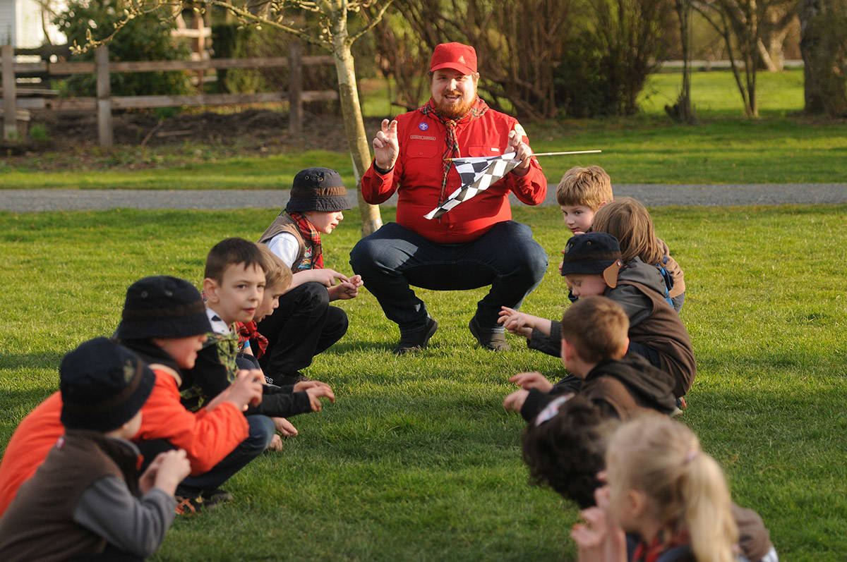 Brent Hunter, Beaver Scouter, does a chant with the 6th Chilliwack Beavers and 26th Unsworth Beavers before their Beaver Buggy races at Gwynne Vaughan Park on Tuesday, April 6, 2021. (Jenna Hauck/ Chilliwack Progress)