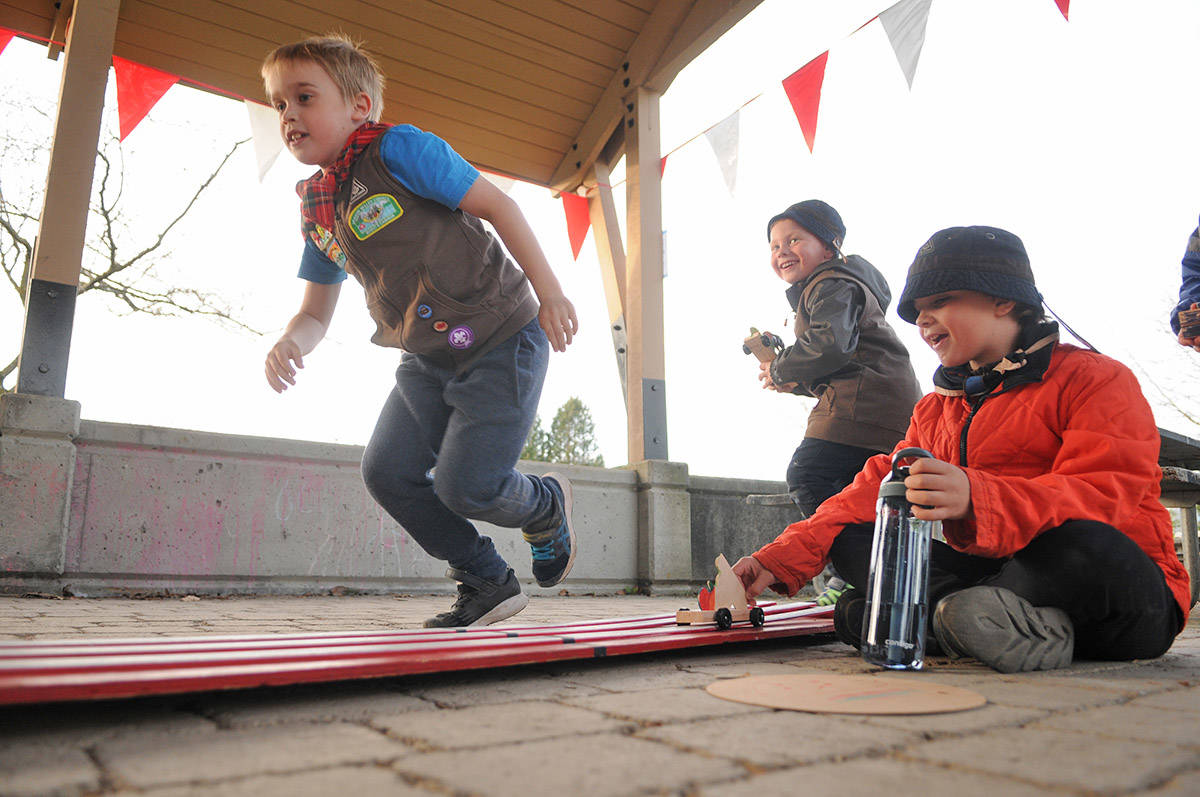 From left, Gabriel Kushniruk, Logan Holitzki and Griffin Kealy with 6th Chilliwack Beavers and 26th Unsworth Beavers scoot to get back in line to race their Beaver Buggies again at Gwynne Vaughan Park on Tuesday, April 6, 2021. (Jenna Hauck/ Chilliwack Progress)