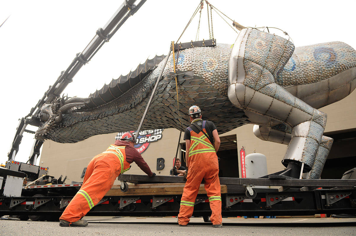 Crews prepare to move Kevin Stones 8,000-pound unfinished steel dragon from Stones Speed Shop to a new location in Yarrow on Thursday, April 29, 2021 (Jenna Hauck/ Chilliwack Progress)