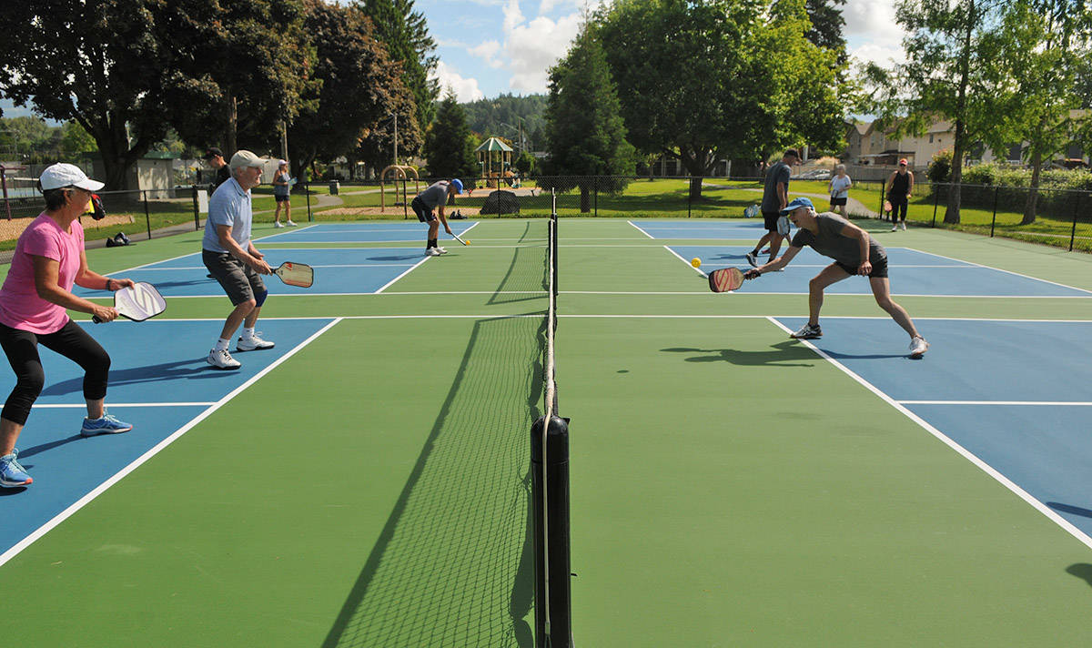 People play pickleball on the new courts at Kinsmen Park in Chilliwack on Tuesday, May 25, 2021. (Jenna Hauck/ Chilliwack Progress)