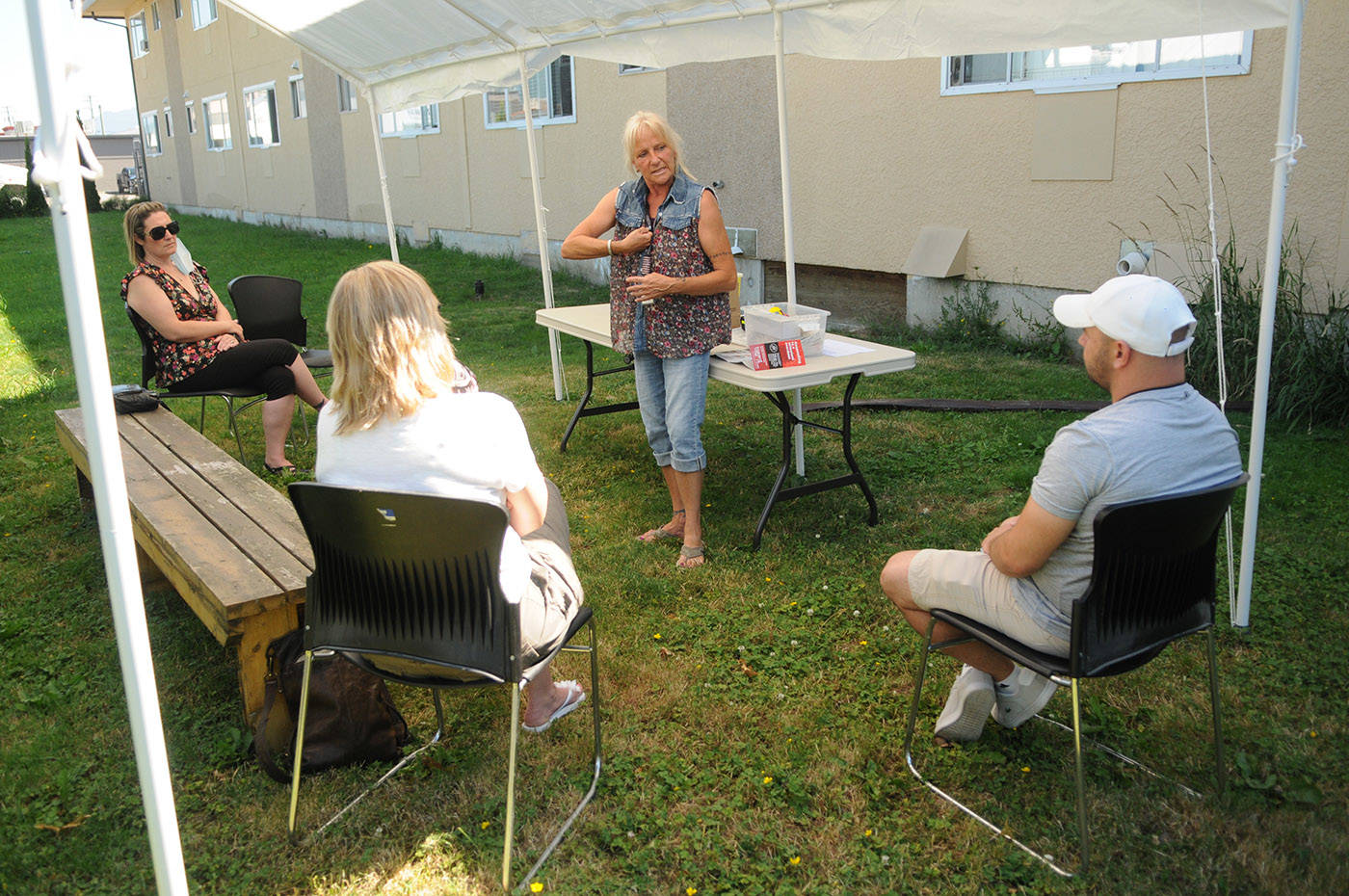 Kim Lloyd, program supervisor with Pacific Community Resources Society (PCRS) in Chilliwack, explains how a knuckle to the sternum is one of the first steps in determining a suspected opioid overdose during a free friends and family naloxone training workshop at Chilliwack Health and Housing Centre on Tuesday, June 22, 2021. (Jenna Hauck/ Chilliwack Progress)