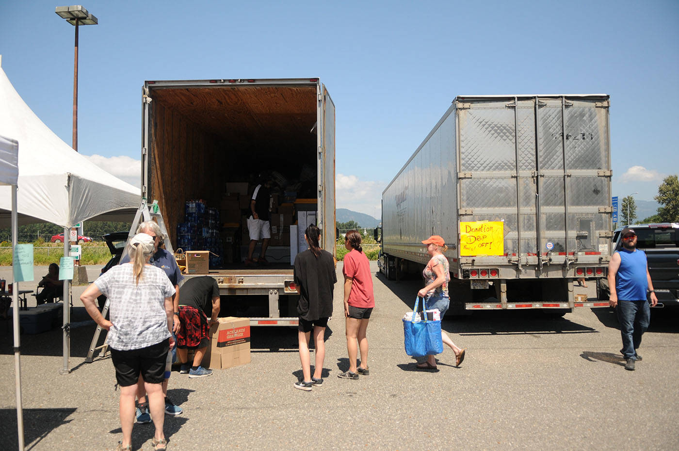 Folks take part in a donation drive for wildfire victims in the old Sears parking lot at Cottonwood Centre on Saturday, July 3, 2021. (Jenna Hauck/ Chilliwack Progress)