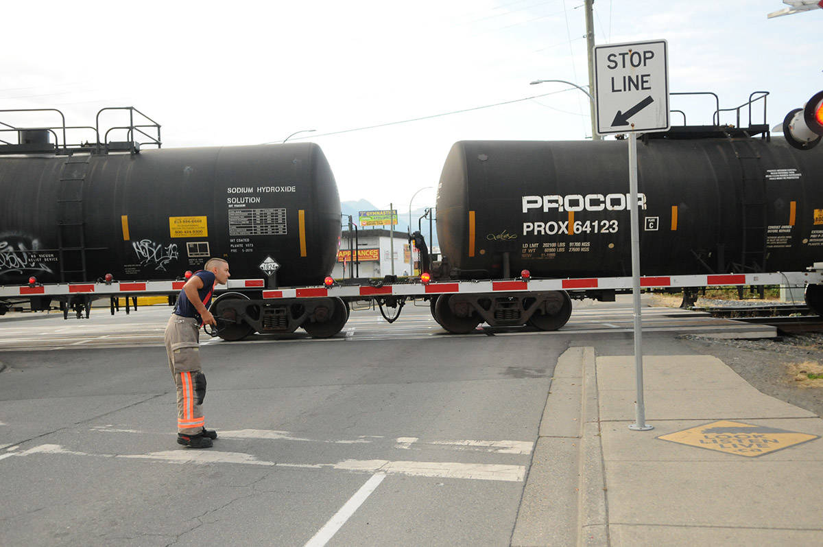 Emergency crews are on scene at the railway crossing on Young Road for a pedestrian who was reportedly struck by a train in Chilliwack on Thursday, Aug. 19. (Jenna Hauck/ Chilliwack Progress)