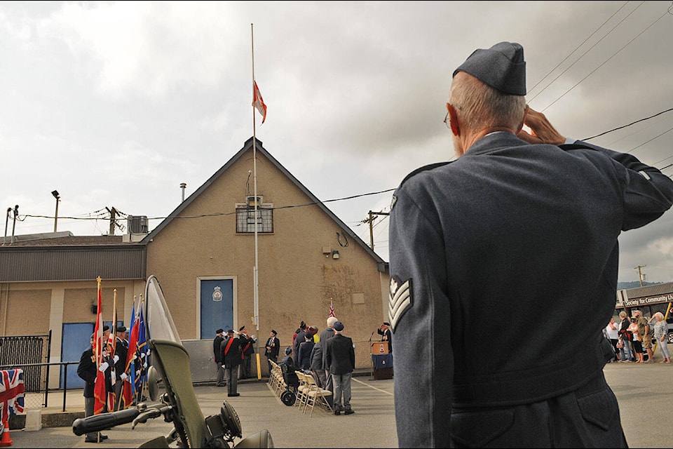 A Royal Canadian Air Force veteran salutes as the Canadian flag is lowered during the legion-closing ceremony at the Royal Canadian Legion Branch 4 on Mary Street on Friday, Sept. 10, 2021. (Jenna Hauck/ Chilliwack Progress)