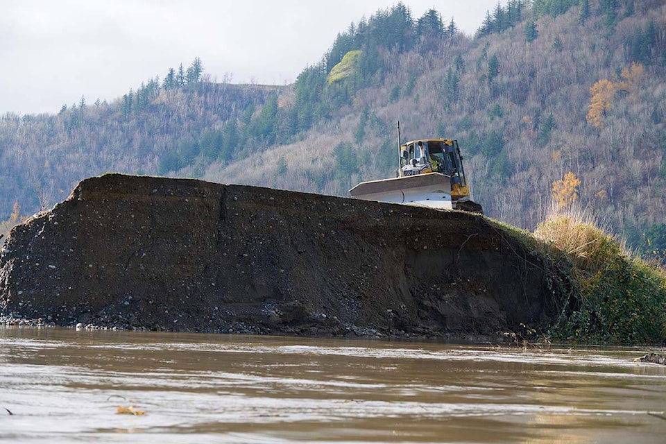 Work began Friday morning (Nov. 19) to build a temporary replacement for the Sumas Dike in Abbotsford in the area of Marion and No. 4 roads. (Photos: City of Abbotsford)