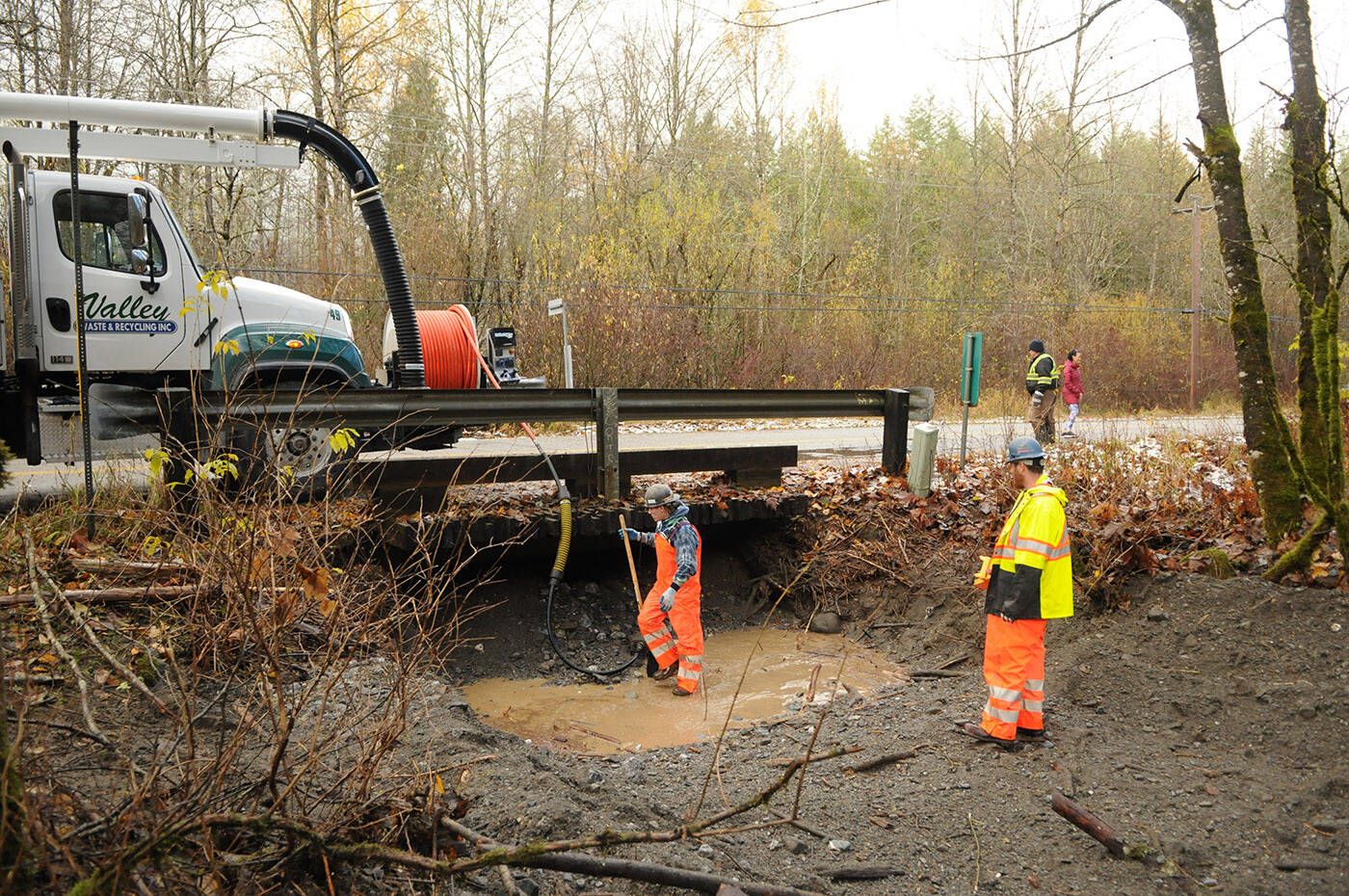 Crews from Valley Waste and Recycling remove rocks and debris from underneath the Pierce Creek Bridge on Friday, Nov. 19, 2021. (Jenna Hauck/ Chilliwack Progress)