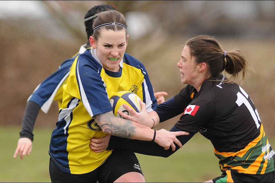 Nadine Heath of the Chilliwack Crusaders women’s rugby team rips through a Langley player at Yarrow Sportsfield on Saturday, Feb. 26, 2022. That day marked the first ever home game for the new Chilliwack women’s team. (Jenna Hauck/ Chilliwack Progress)