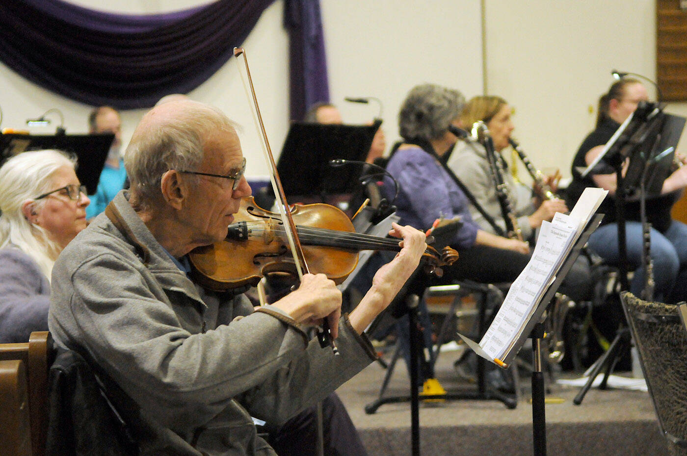 Members of the Chilliwack Metropolitan Orchestra rehearse on Wednesday, March 16, 2022. (Jenna Hauck/ Chilliwack Progress)