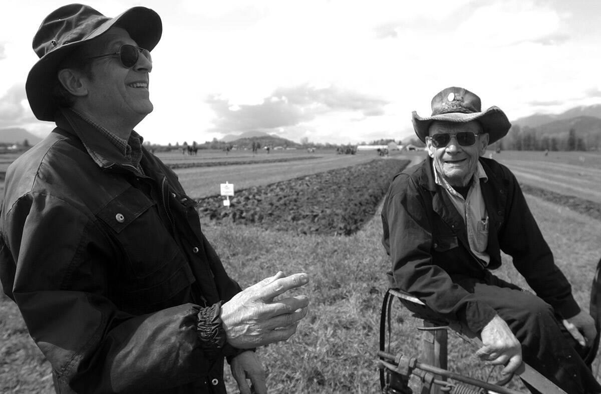 François Freyvogel (left) shares a laugh with Ted Giesbrecht during the 83rd annual Chilliwack Plowing Match on April 9, 2005. (Jenna Hauck/ Chilliwack Progress file)