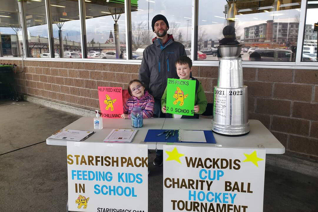 Devin Baker with his kids outside Save-On-Food in Chilliwack raising awareness and money for the Starfish Pack Program. (Submitted)